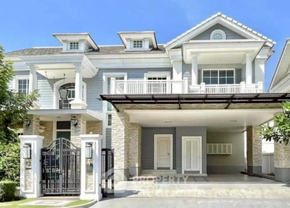 Stunning two-story house with elegant facade and spacious driveway in a serene neighborhood.