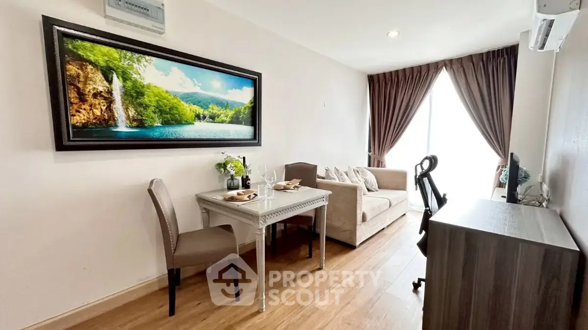 Charming living room with elegant decor and natural light, featuring a cozy seating area and stylish dining setup.