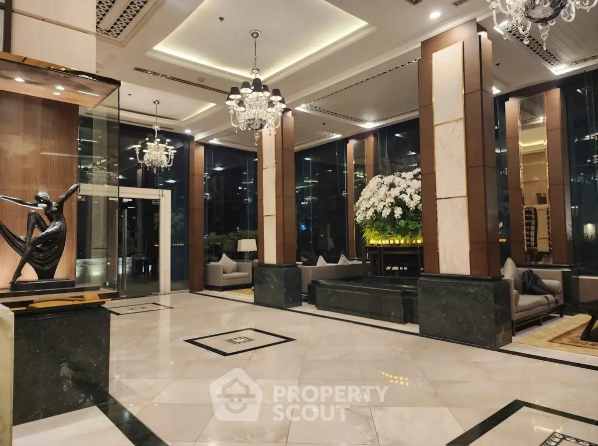 Luxurious hotel lobby with elegant chandeliers and modern decor