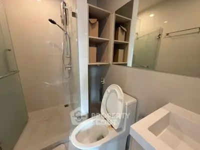 Modern bathroom with glass shower and sleek fixtures