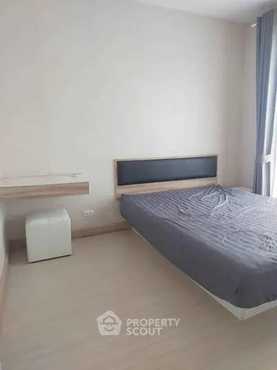 Spacious bedroom with modern minimalist design and natural light