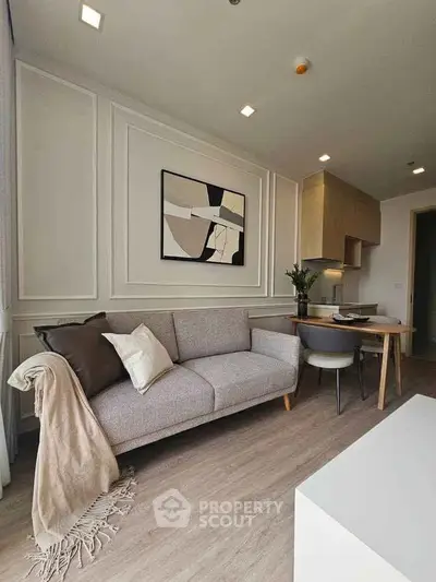 Modern living room with stylish decor and cozy seating area, perfect for relaxation and entertaining.