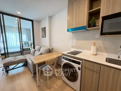 Modern studio apartment with open kitchen and cozy living area