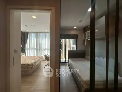 Modern dual-bedroom apartment with large windows and stylish decor