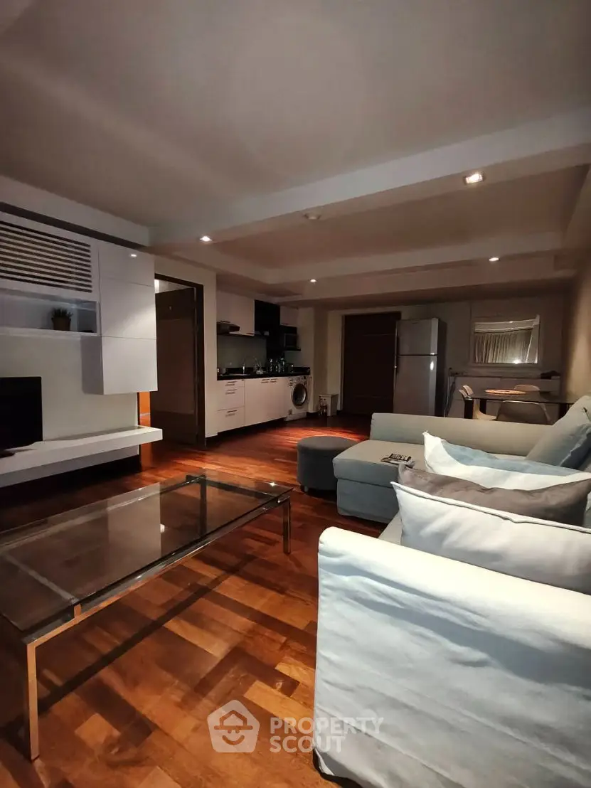 Spacious modern living room with open kitchen and stylish furnishings