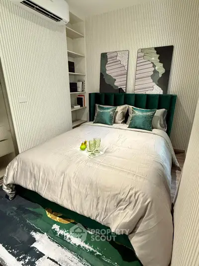 Luxurious bedroom with modern decor and plush bedding in a stylish apartment.