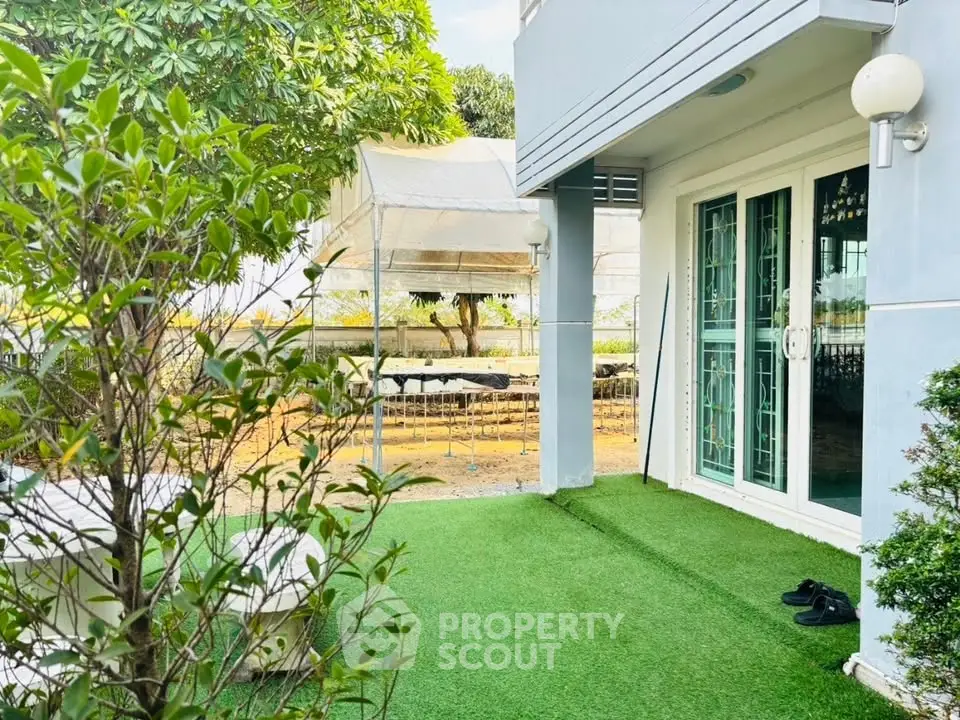 Charming garden view with lush greenery and modern patio area