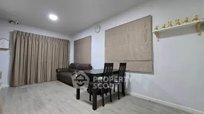 Modern living room with sleek furniture and neutral tones, perfect for relaxation and entertaining.