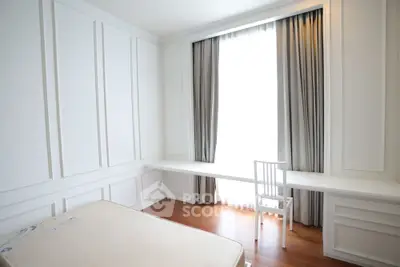 Bright minimalist bedroom with large window and wooden flooring