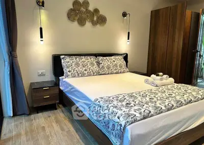 Elegant bedroom with modern decor, featuring a cozy bed, stylish lighting, and wooden accents for a serene ambiance.