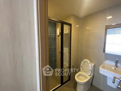 Modern bathroom with glass shower and sleek fixtures