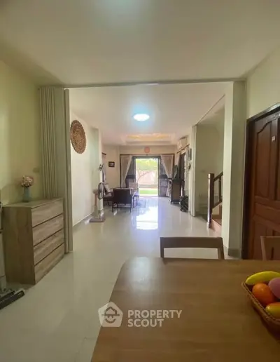 Spacious living room with modern decor and natural light