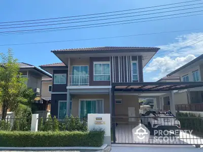 Modern two-story house with carport and landscaped front yard in a suburban neighborhood.