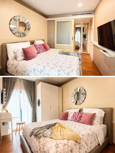Charming bedroom with elegant decor, plush bedding, and stylish mirror accents.
