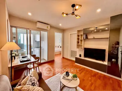 Modern living room with open layout and stylish decor in a cozy apartment.