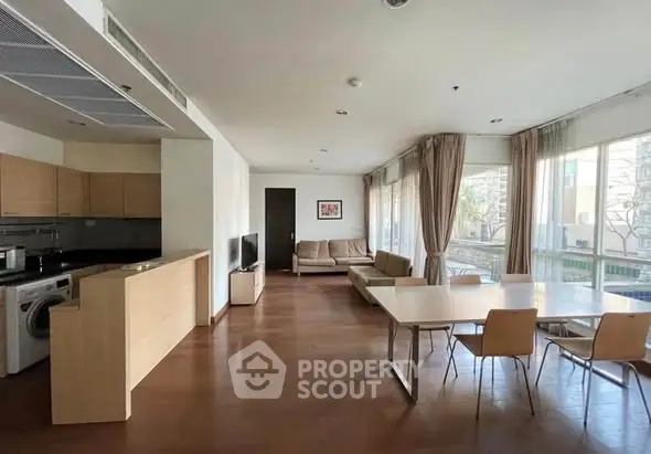 Spacious modern living room with open kitchen and large windows