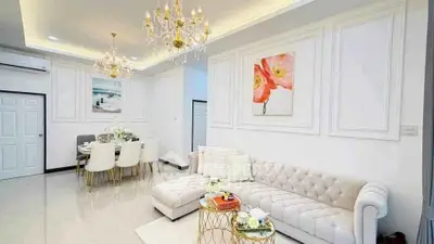 Luxurious living room with elegant chandelier and plush seating in modern home