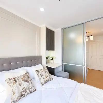 Modern bedroom with stylish decor and sliding glass door