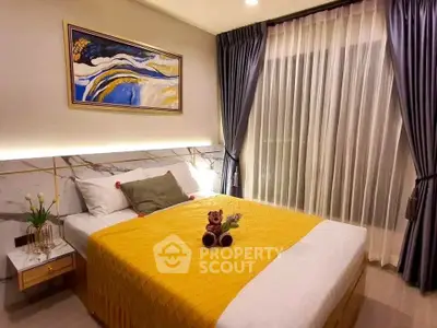Elegant bedroom with modern decor, featuring a cozy bed, stylish artwork, and soft lighting for a serene ambiance.
