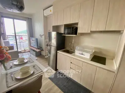 Modern kitchen with open layout and dining area in a stylish apartment