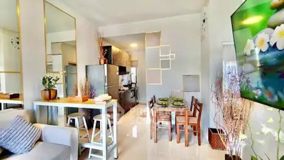 Modern open-plan living and dining area with stylish decor and natural light.