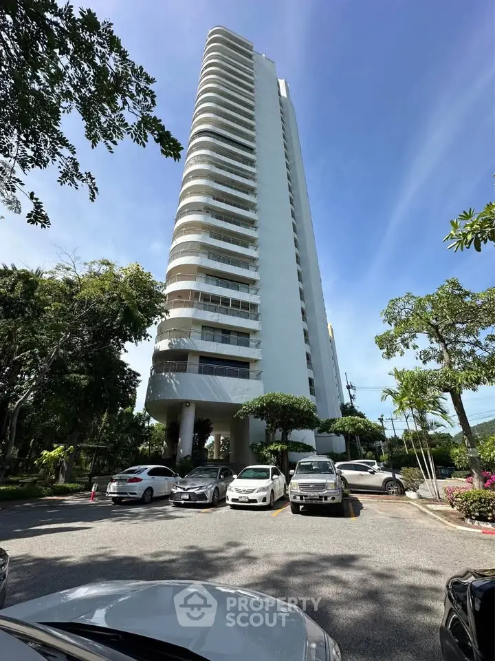 Stunning high-rise building with modern architecture and ample parking space