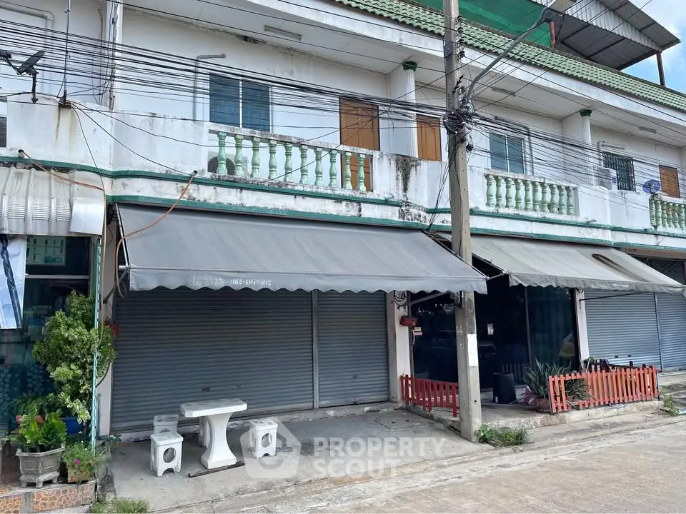 Charming commercial property with potential, featuring a classic facade and ample space for business opportunities.
