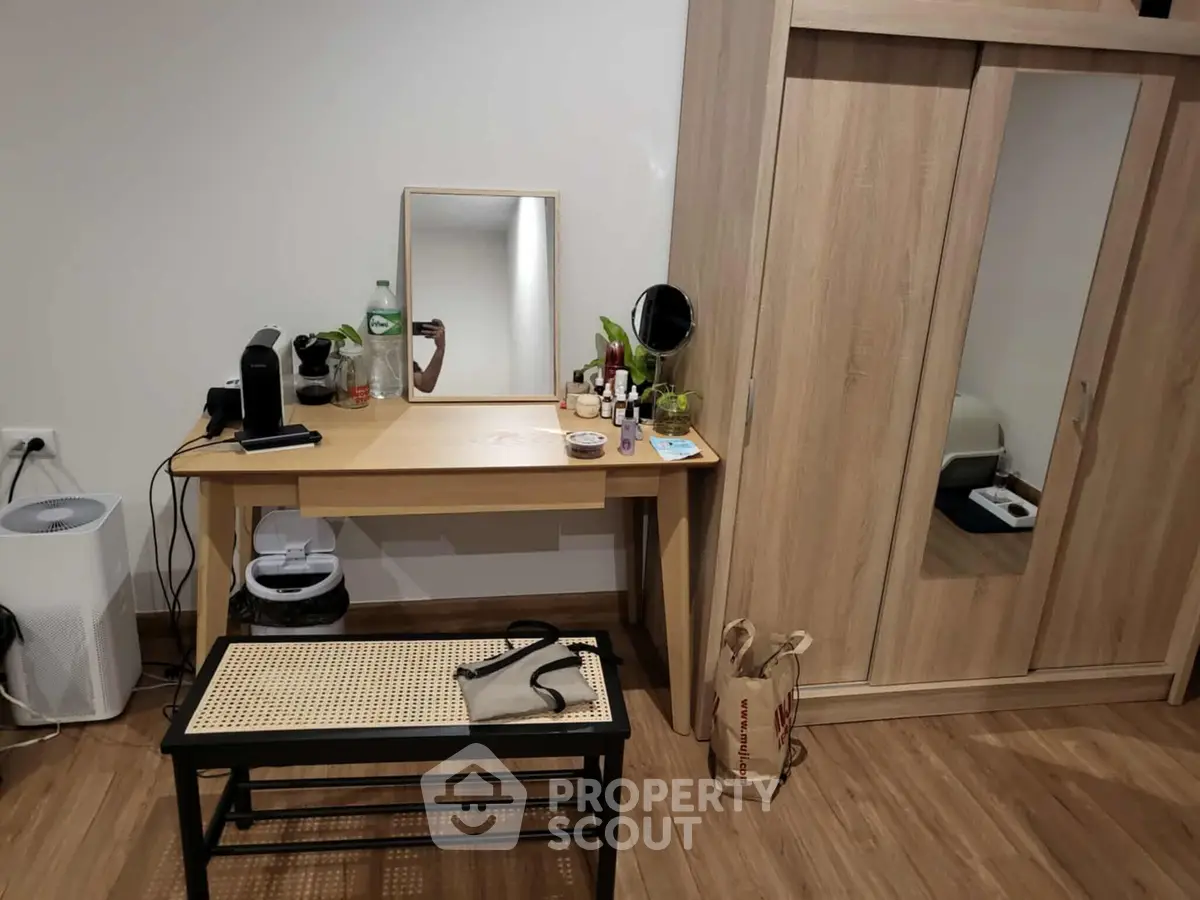 Cozy bedroom with wooden wardrobe and stylish vanity table