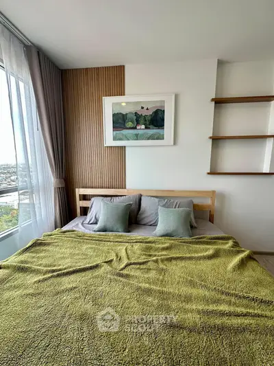 Modern bedroom with large window and stylish decor in urban apartment