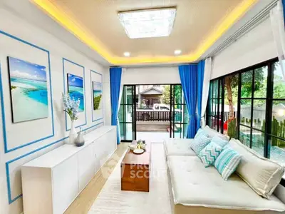 Bright and modern living room with large windows and stylish decor