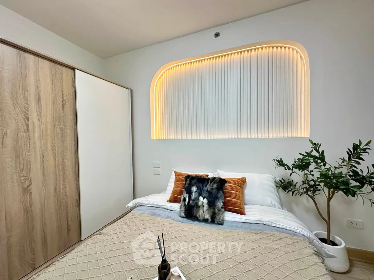 Modern bedroom with stylish lighting and cozy decor