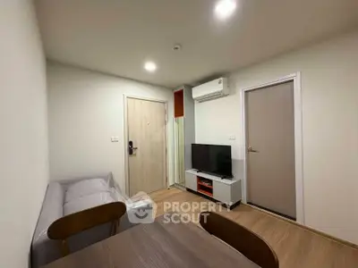 Modern living room with sleek furniture and air conditioning in a cozy apartment.
