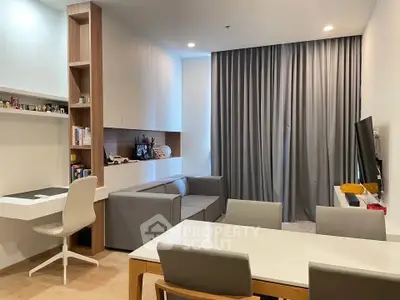Modern living room with sleek furniture and integrated study area, perfect for urban living.