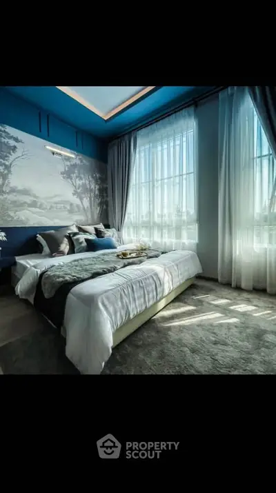 Luxurious bedroom with large windows and elegant decor, featuring a cozy bed and stylish wall art.