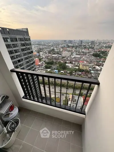 Stunning high-rise balcony with panoramic city views, perfect for urban living enthusiasts.