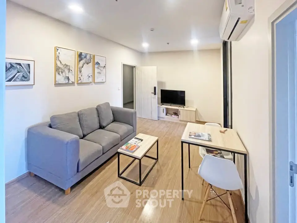 Modern living room with stylish decor and comfortable seating in a contemporary apartment.