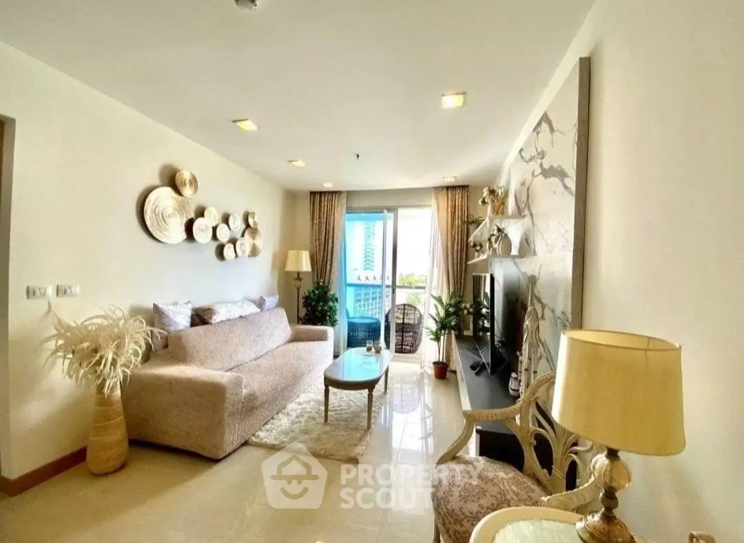 Elegant living room with modern decor and balcony view