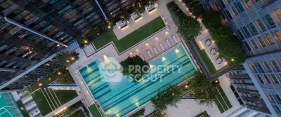 Luxurious aerial view of modern apartment complex with stunning pool and landscaped gardens.