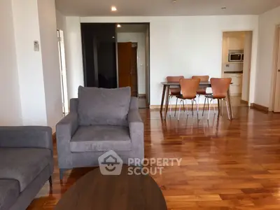 Spacious modern living room with wooden flooring and stylish dining area