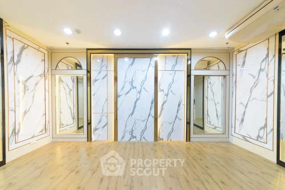 Luxurious interior with marble accents and wood flooring, perfect for modern living spaces.