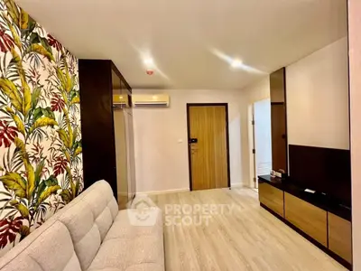 Stylish living room with floral accent wall and modern furnishings