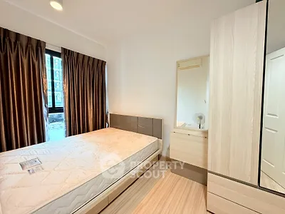 Modern bedroom with stylish decor and ample natural light