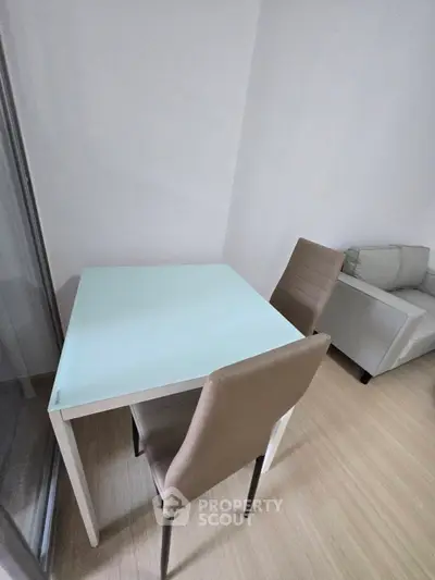 Modern minimalist living room with sleek furniture and wooden flooring