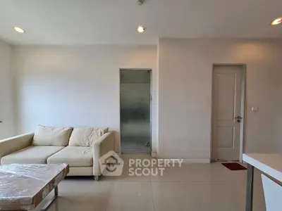 Modern living room with beige sofa and minimalist decor