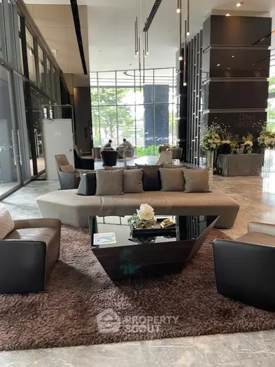 Luxurious modern living room with elegant furniture and large windows