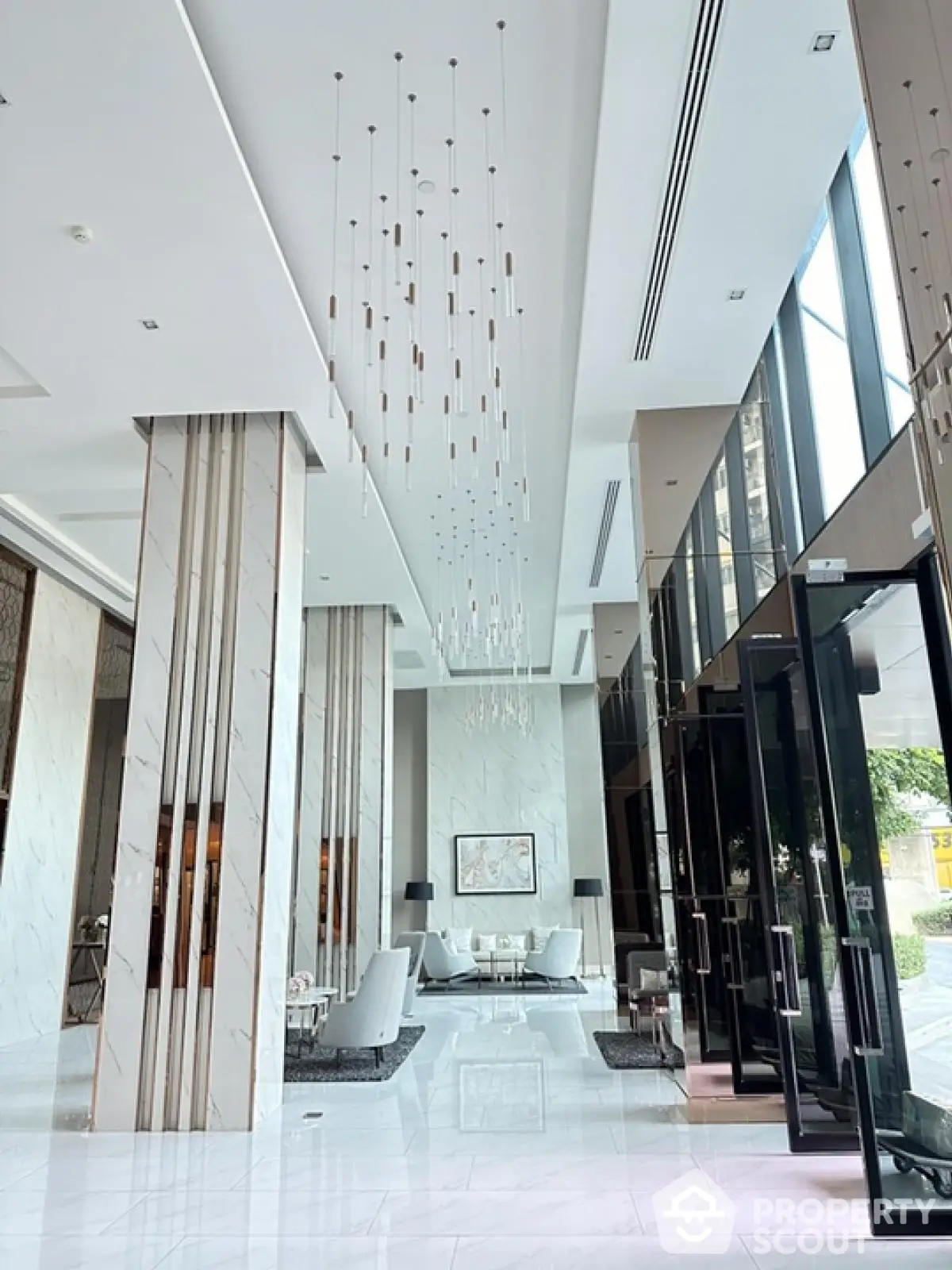 Luxurious modern building entrance with elegant decor and high ceilings