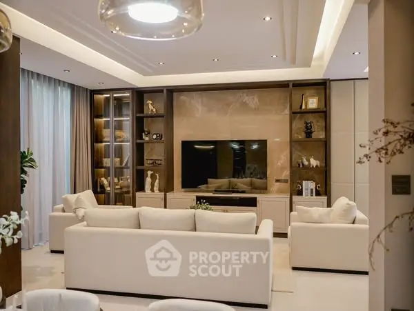 Luxurious modern living room with elegant decor and spacious seating area.