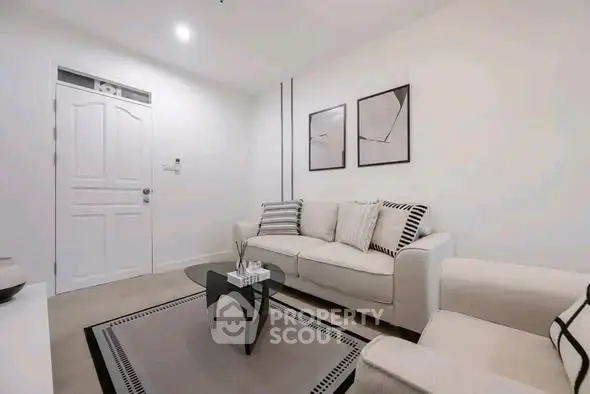 Modern living room with stylish decor and cozy seating area.