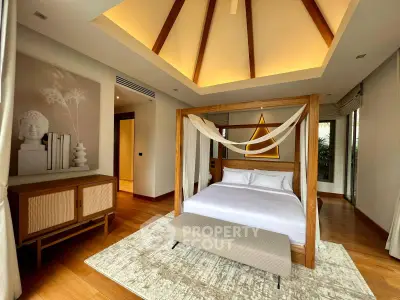 Luxurious bedroom with elegant canopy bed and modern decor
