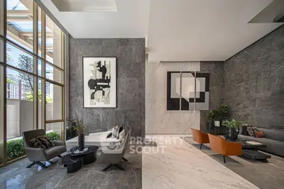 Luxurious modern living room with elegant marble walls and stylish furniture